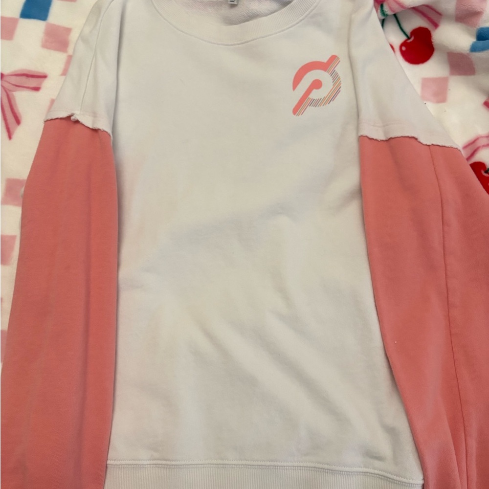 White Peloton sweatshirt with pink sleeves. Size small!
